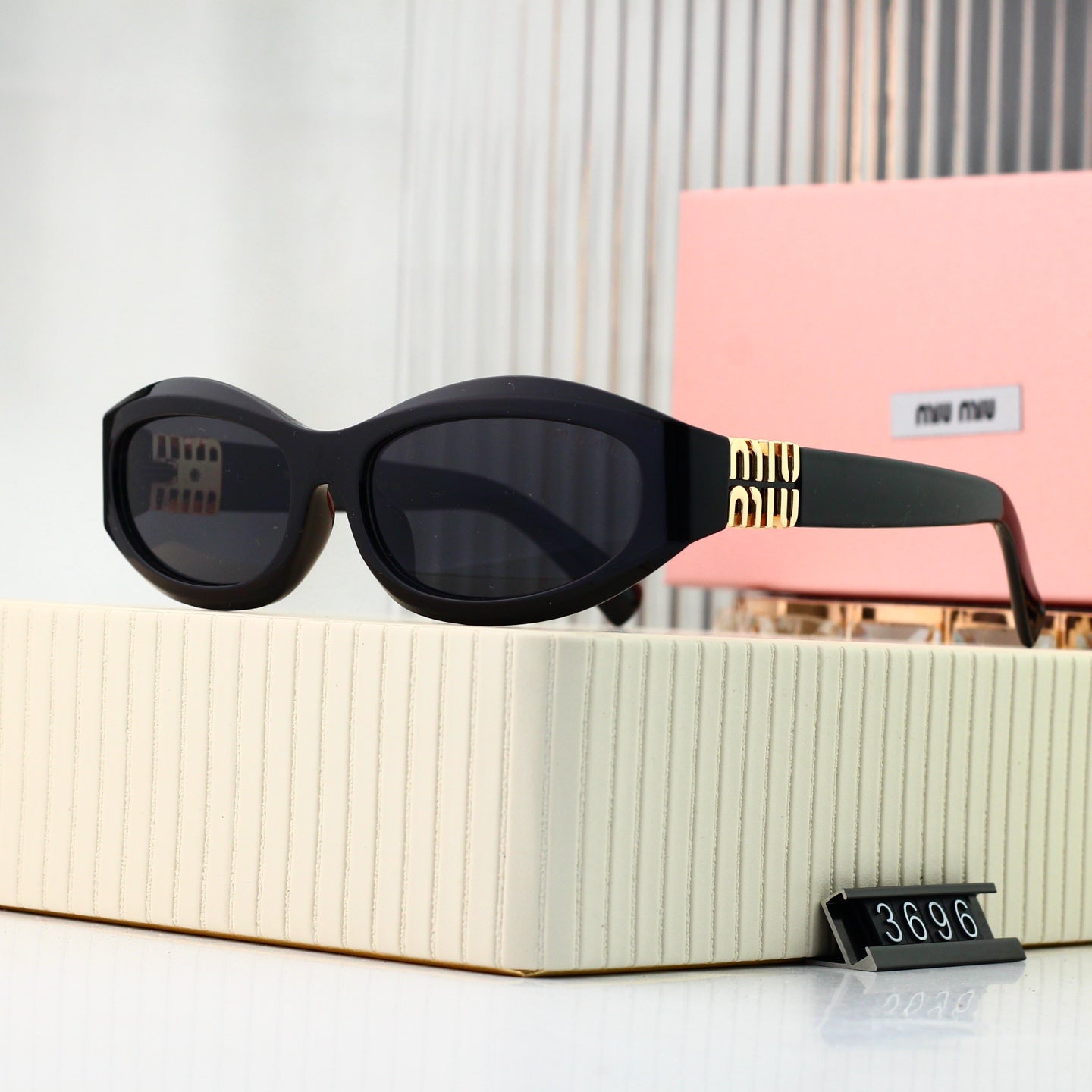 Gafas de Sol Miu Miu Bold Negras con Dorado